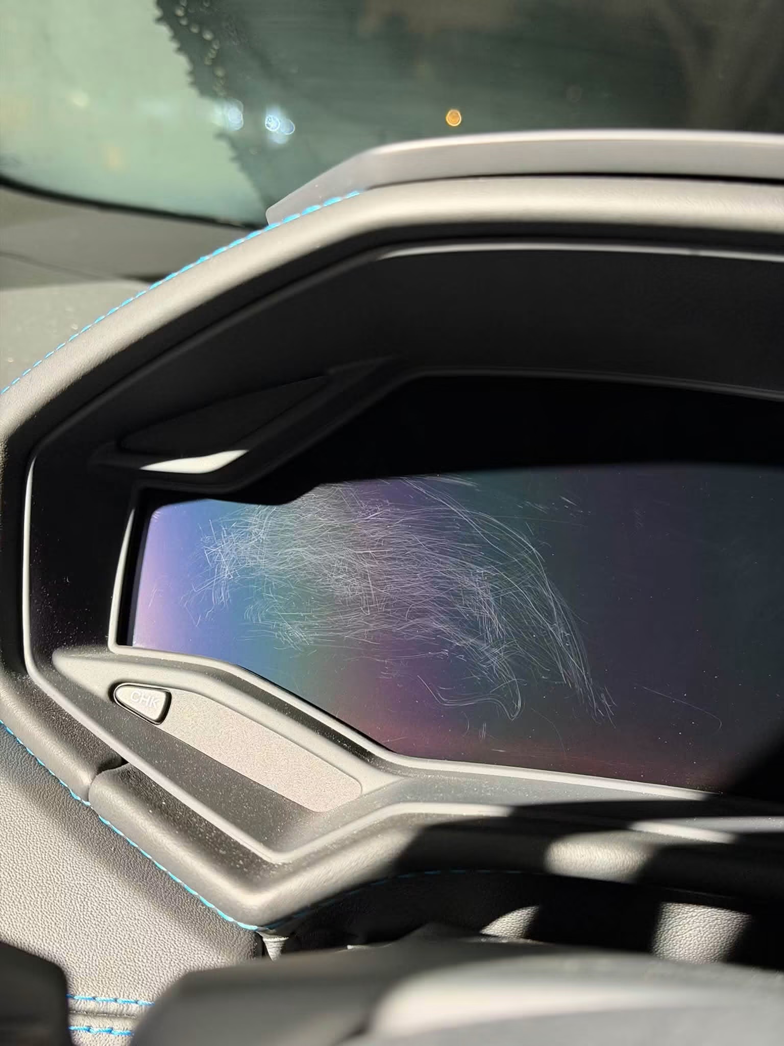 The scratches on Vito’s Huracán driver display that inspired the screen protection kit
